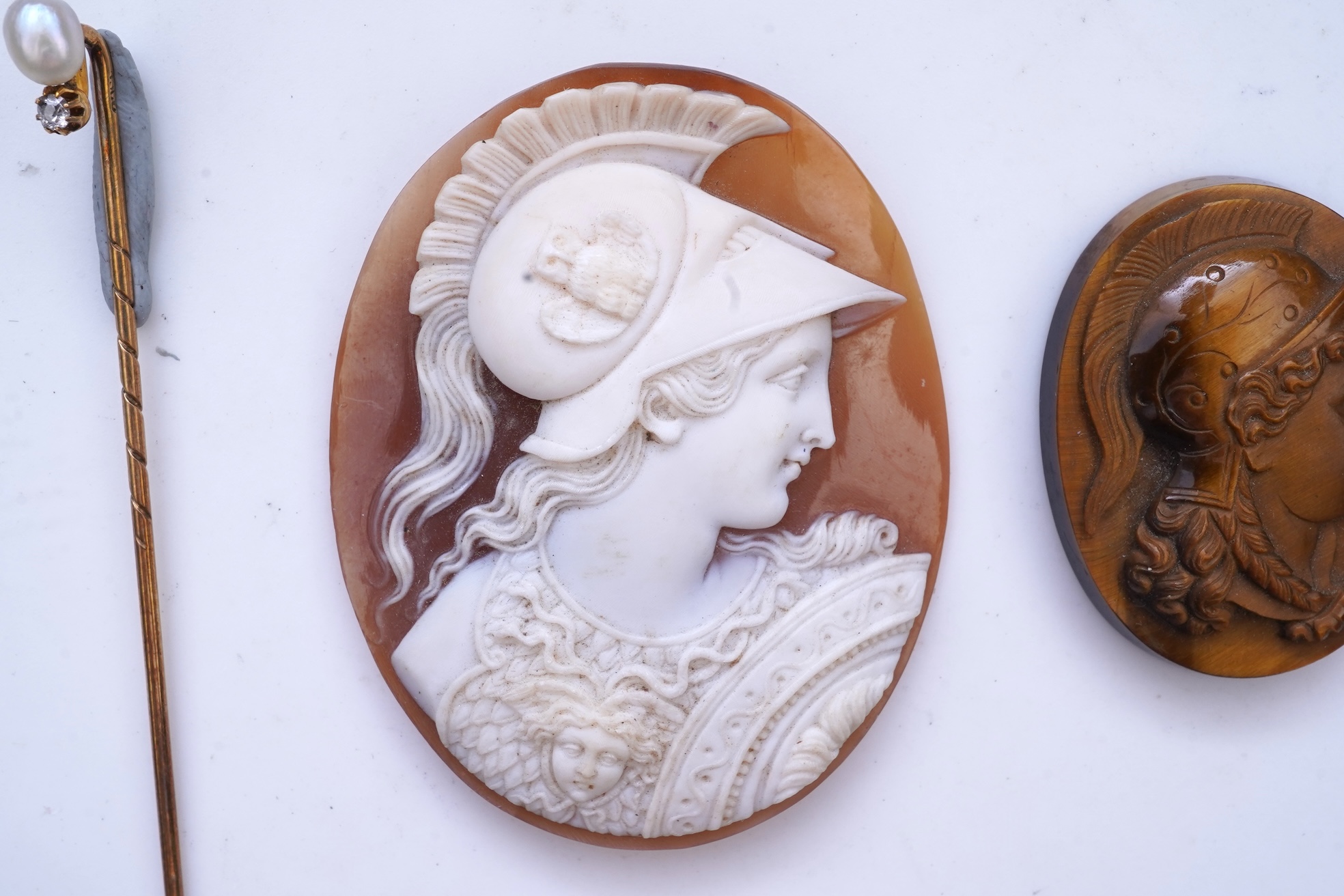 Two cameos and a stick pin, 19th century